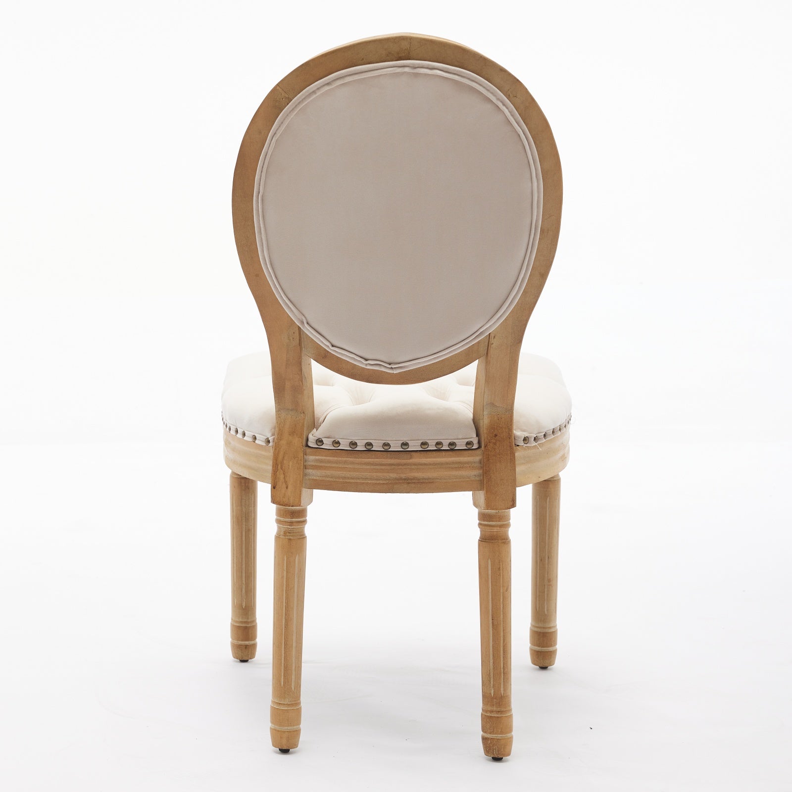Tufted cream upholstered armchair with light wood ornate legs and back