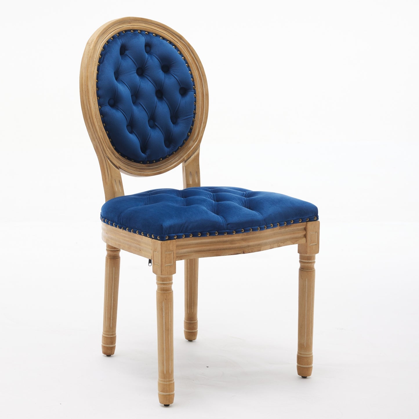 Tufted blue velvet dining chair with ornate wooden legs