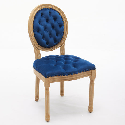 Blue velvet tufted accent chair with wooden legs and brass nailhead trim