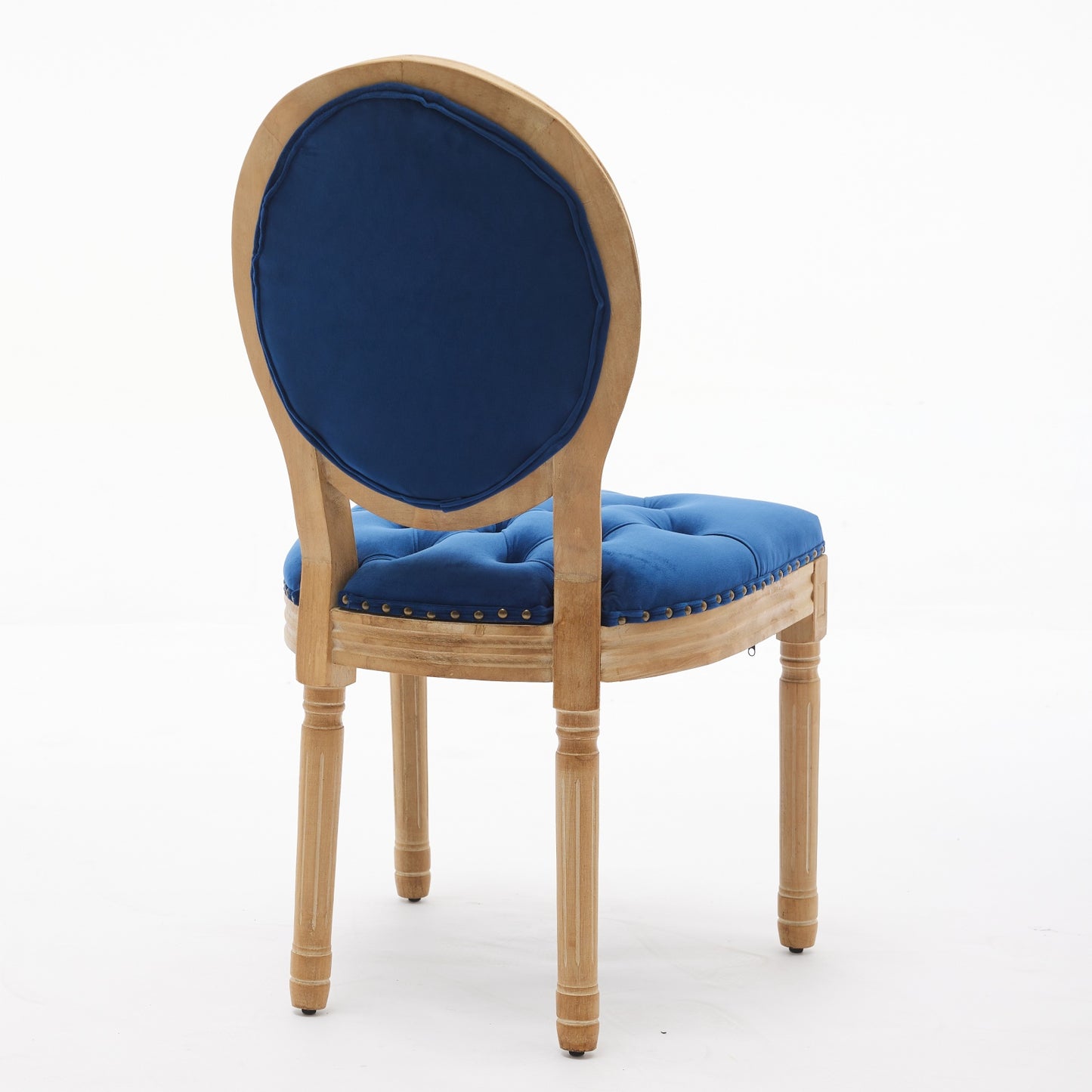 Blue velvet accent chair with tufted seat and natural wood frame