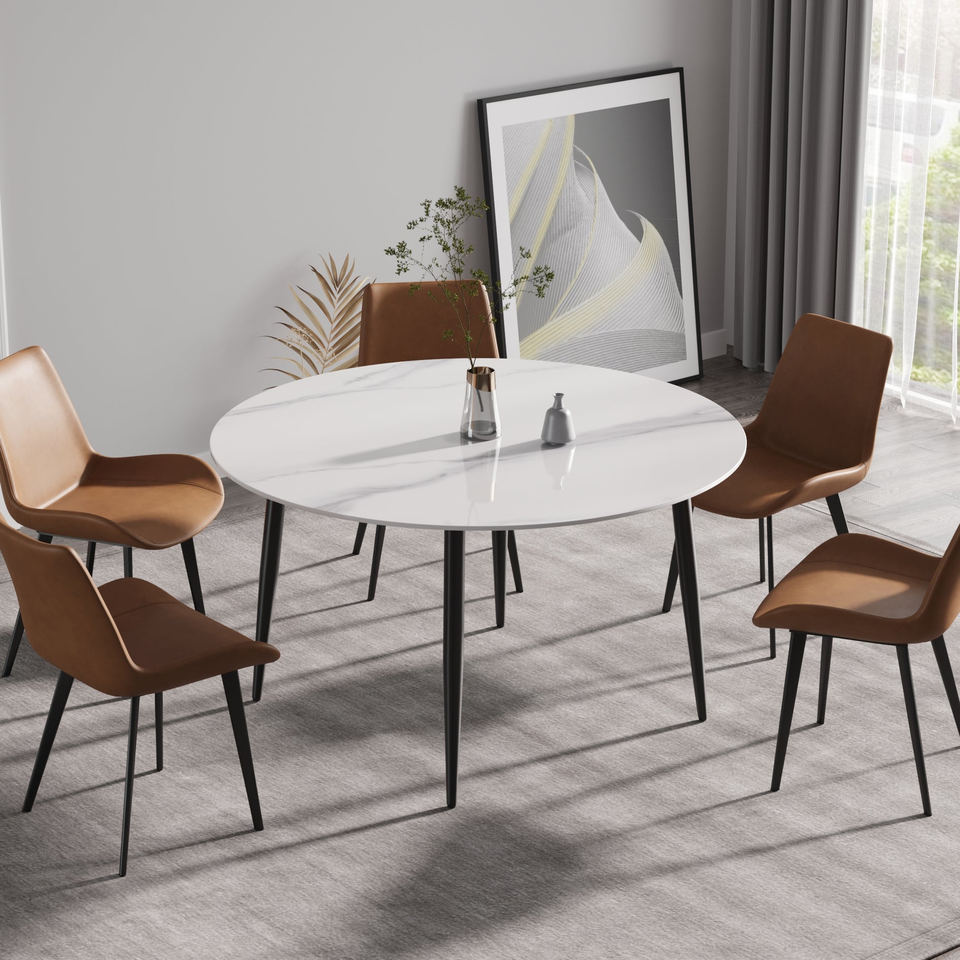 Modern white marble dining table with four brown leather chairs