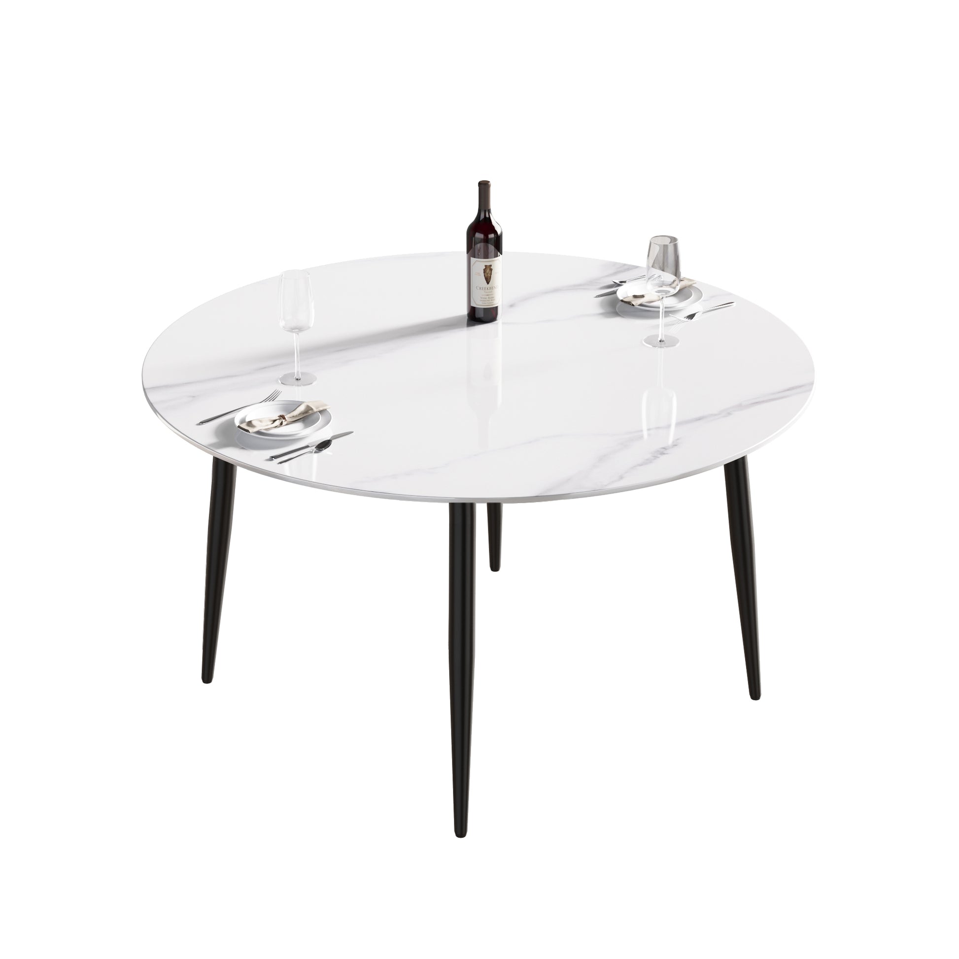 White marble round dining table with black tapered legs and place settings for two