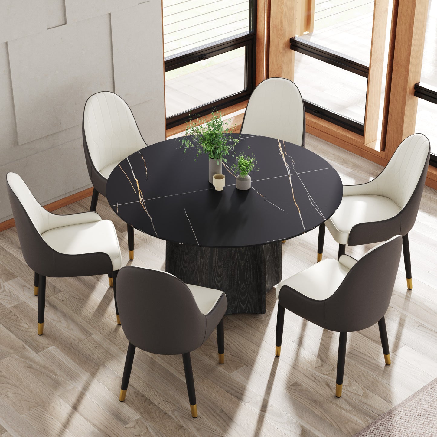 Round black marble dining table with six white and grey upholstered chairs
