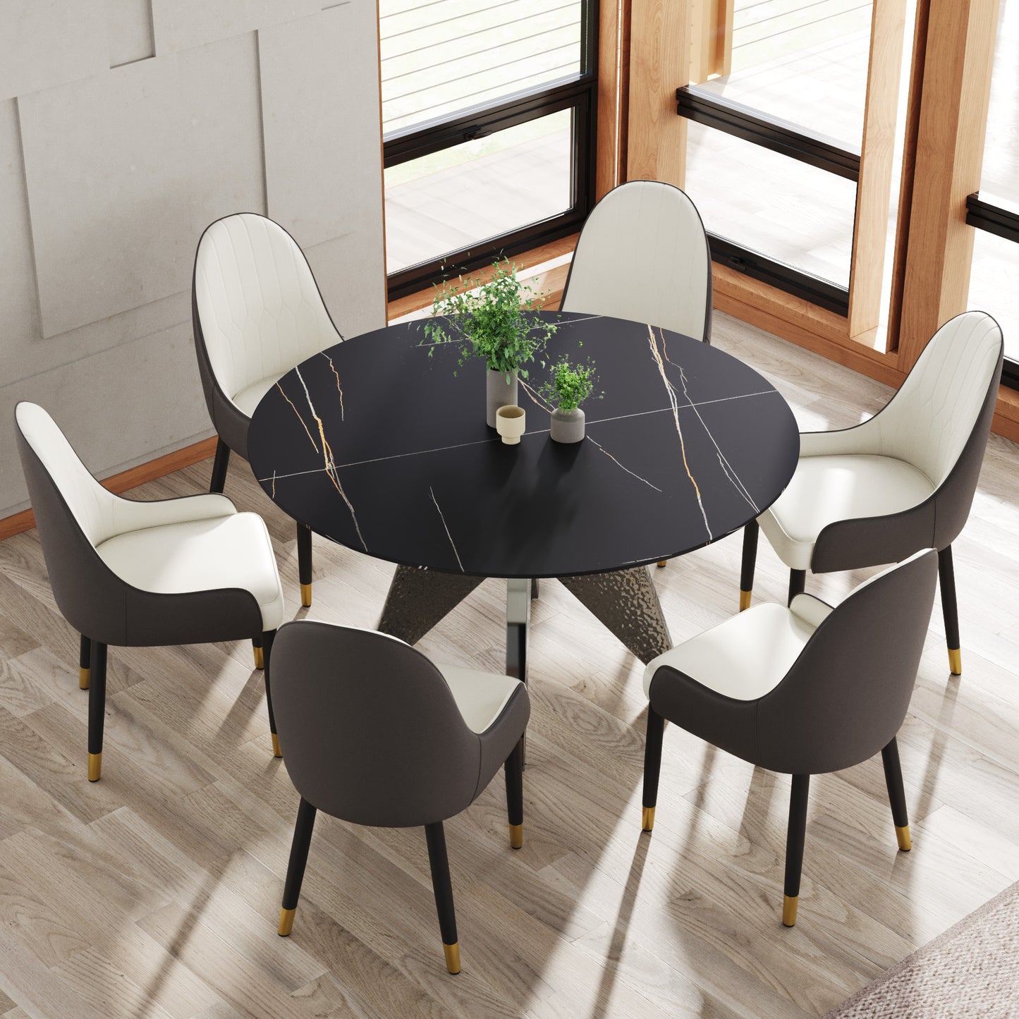 Black marble dining table with gold accents and modern upholstered chairs