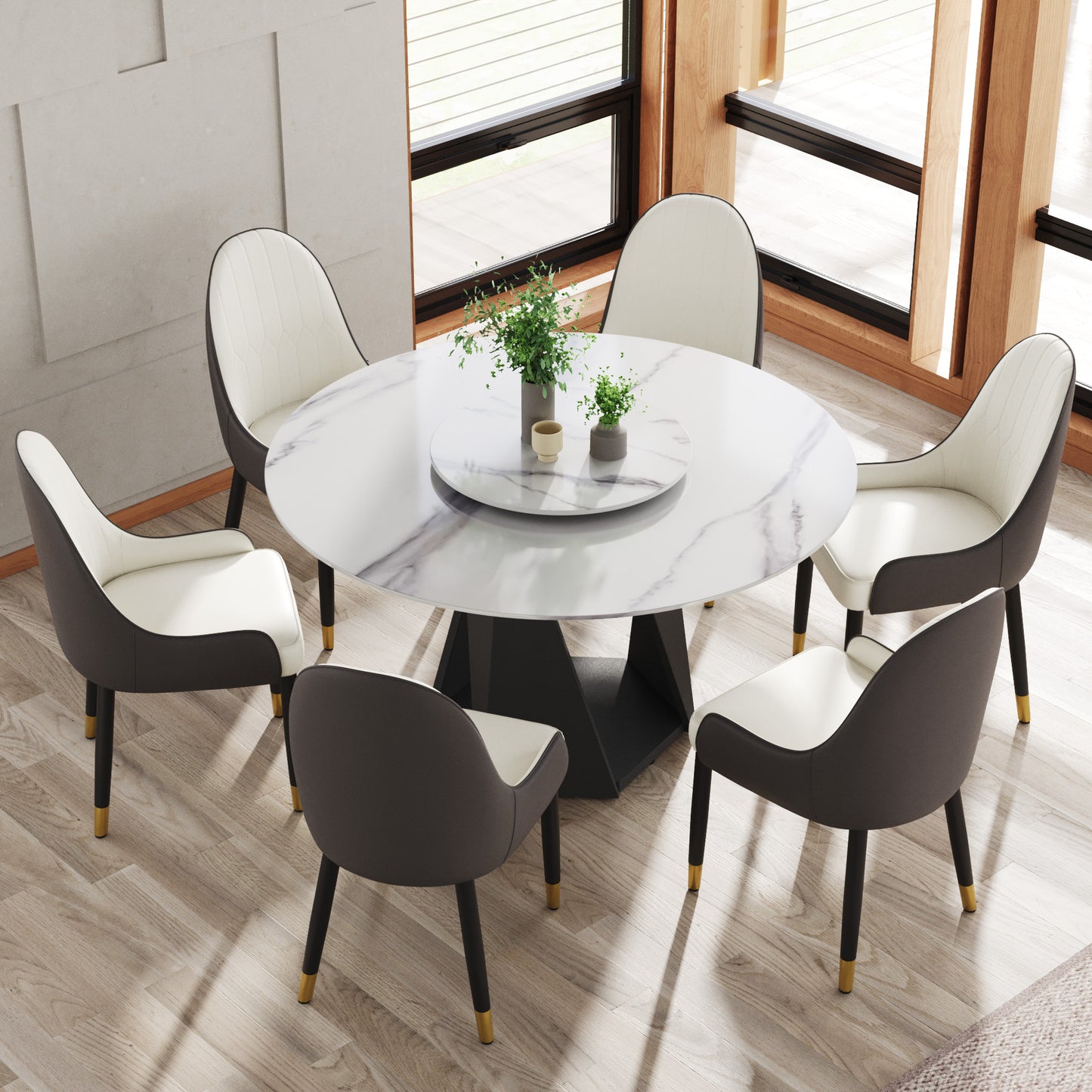 Round marble dining table with six grey and white upholstered chairs
