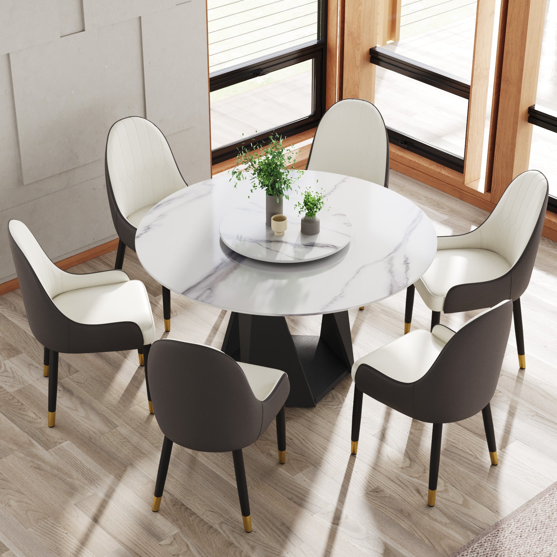 Round marble dining table with six grey and white upholstered chairs
