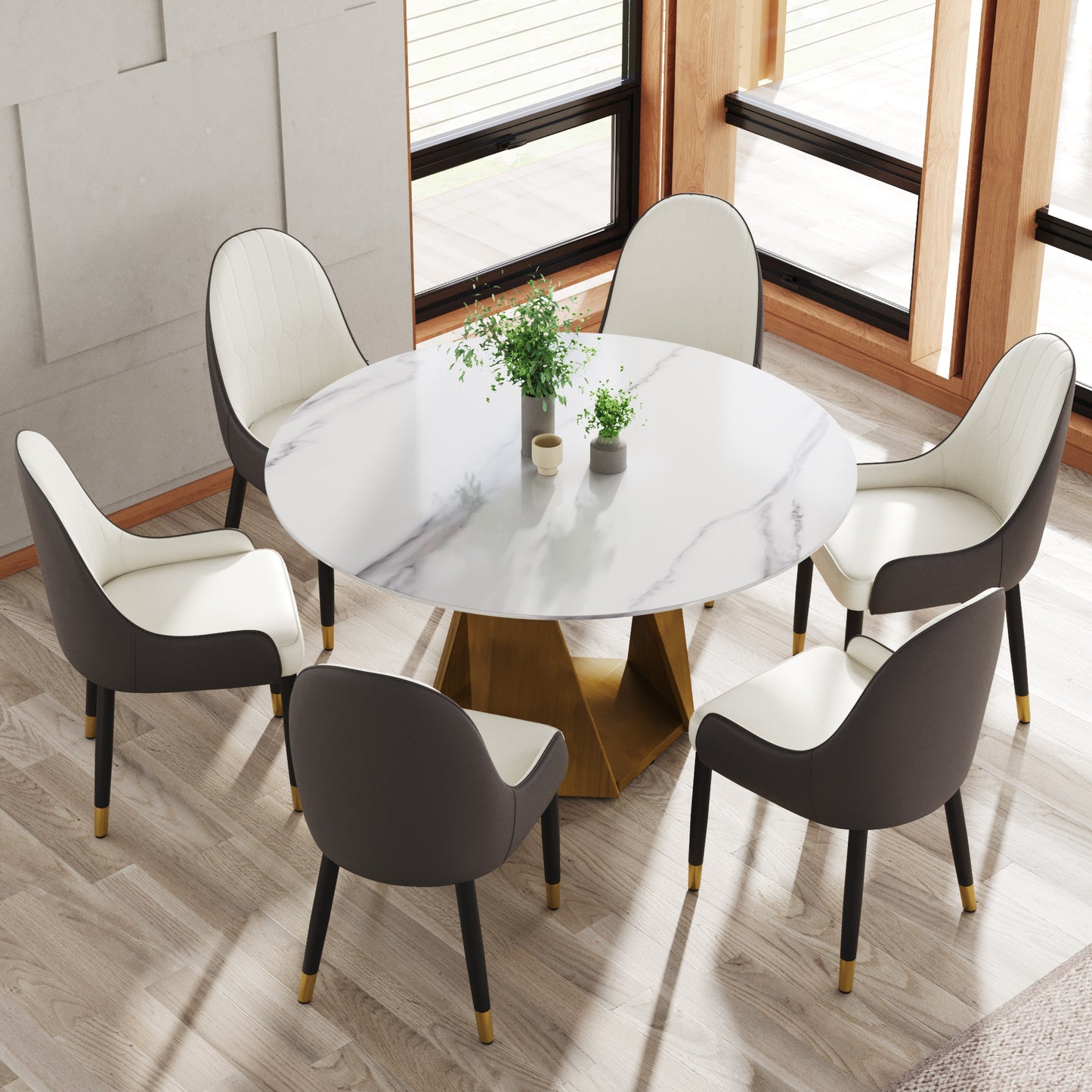 Modern round marble dining table with plush upholstered chairs