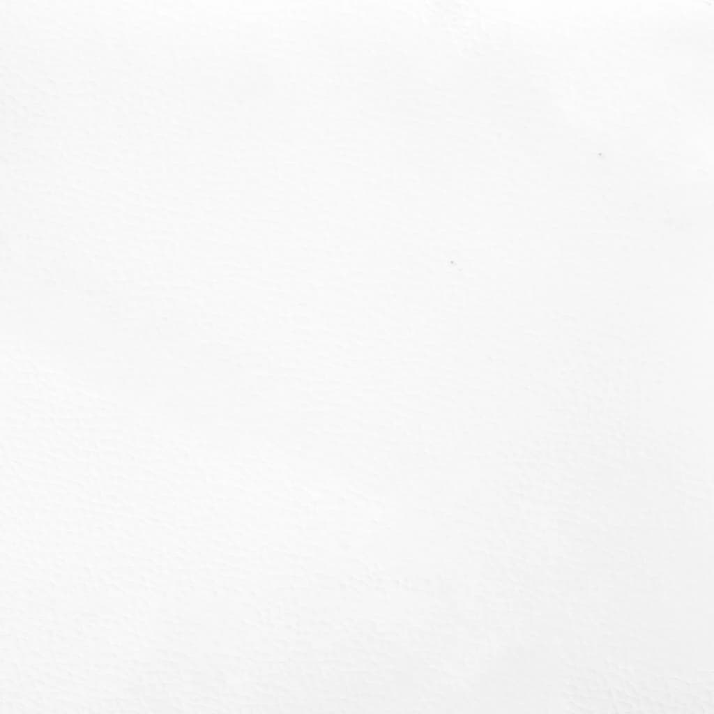 Closeup of a white upholstered bed frame with black cylindrical legs