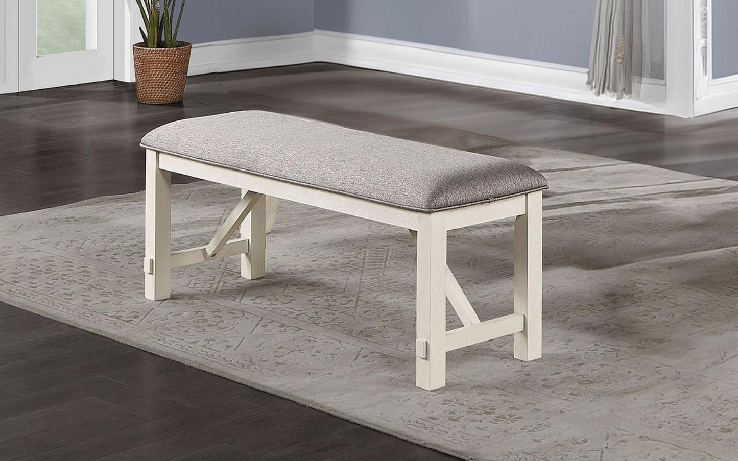 White wood bench with grey upholstered seat and Xframe legs