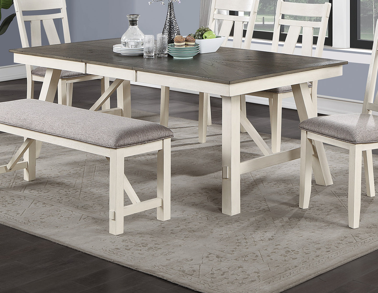 Rustic farmhouse dining table set with upholstered bench in muted grey