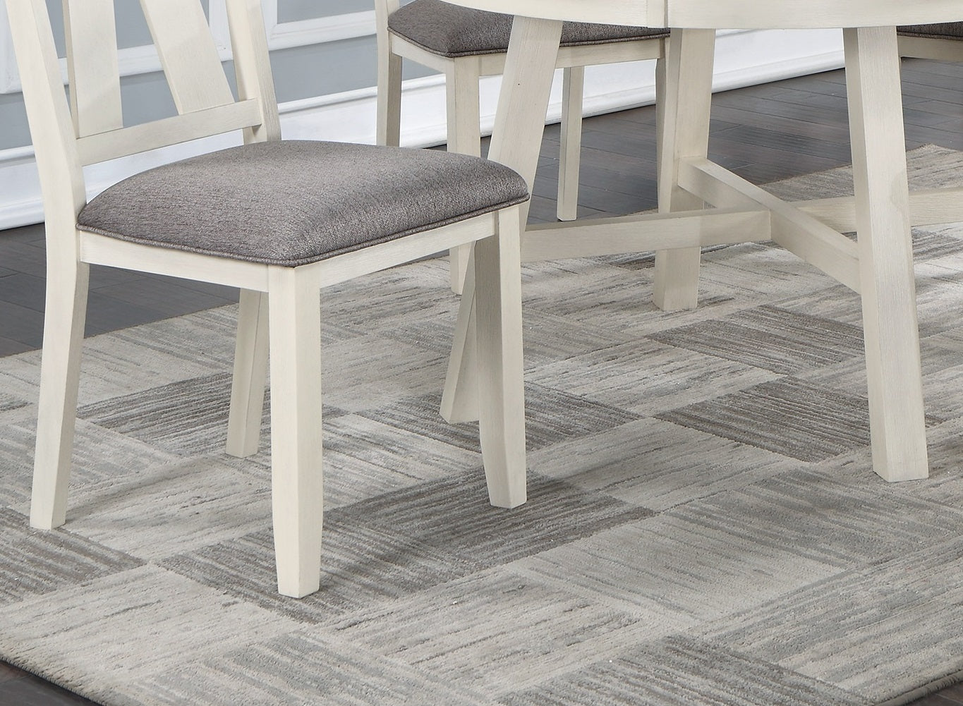 Creamwash dining chair with textured grey upholstered seat