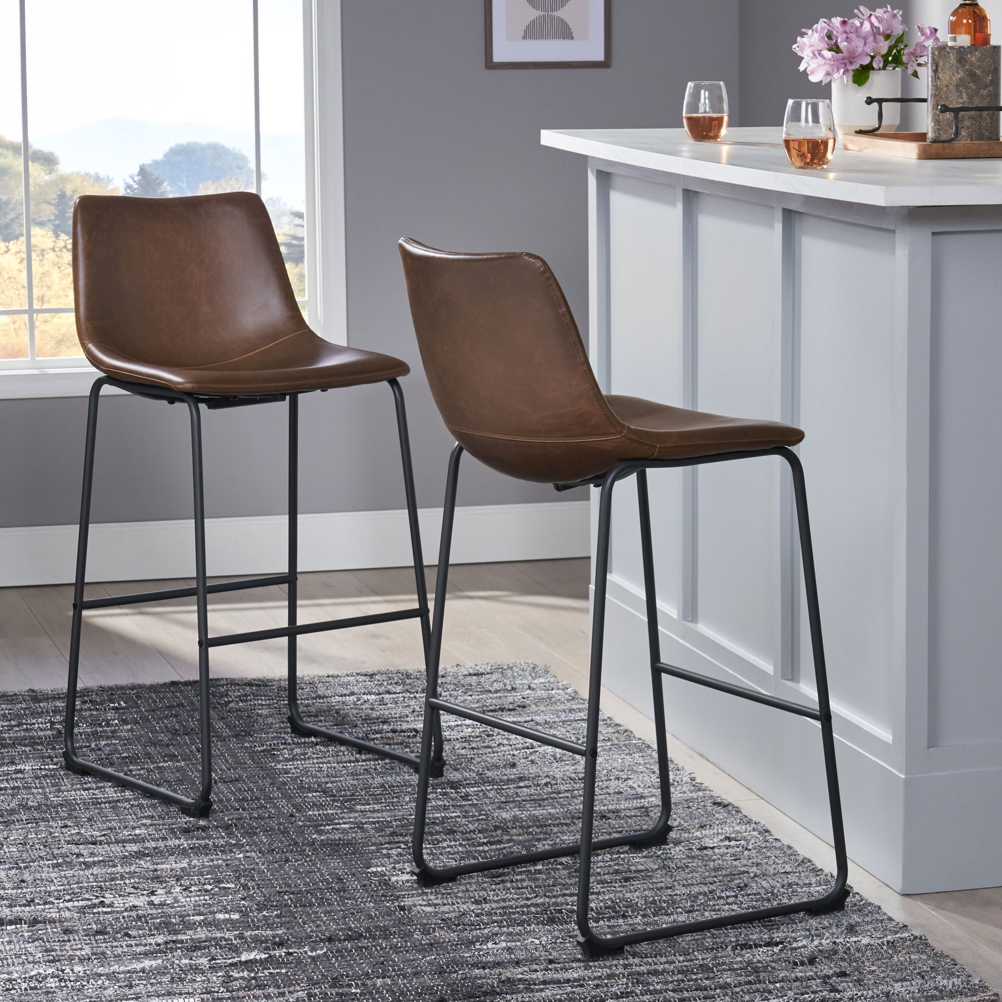 Brown leather bar stool with black metal legs