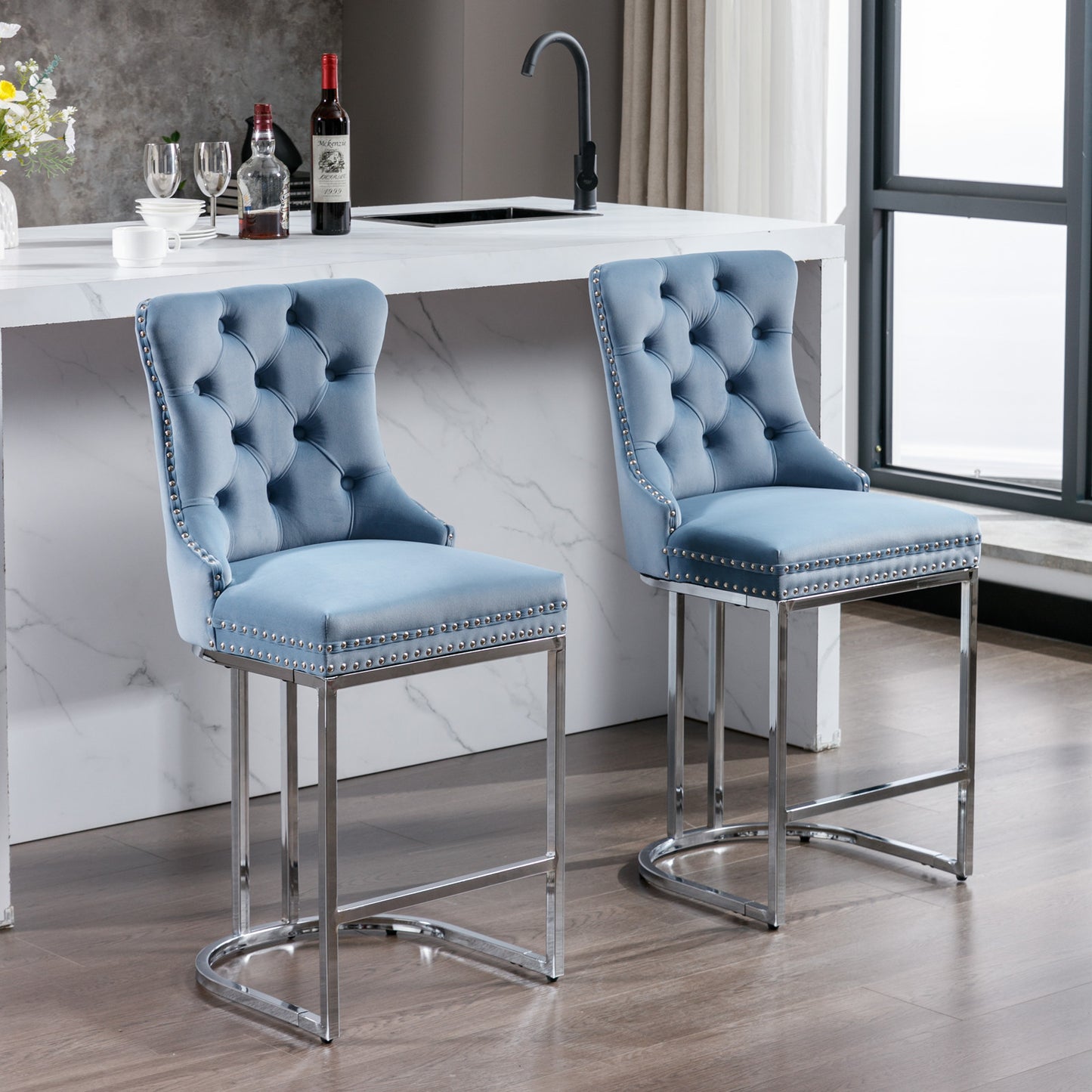 Light blue velvet tufted bar stool with silver nailhead trim and chrome legs