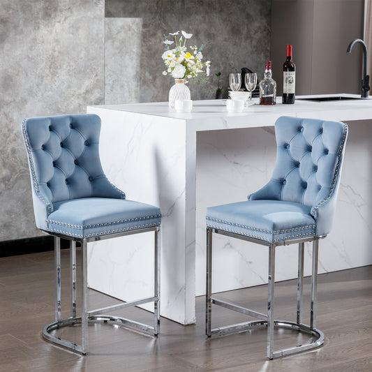 Light blue velvet tufted bar stool with chrome legs and nailhead trim