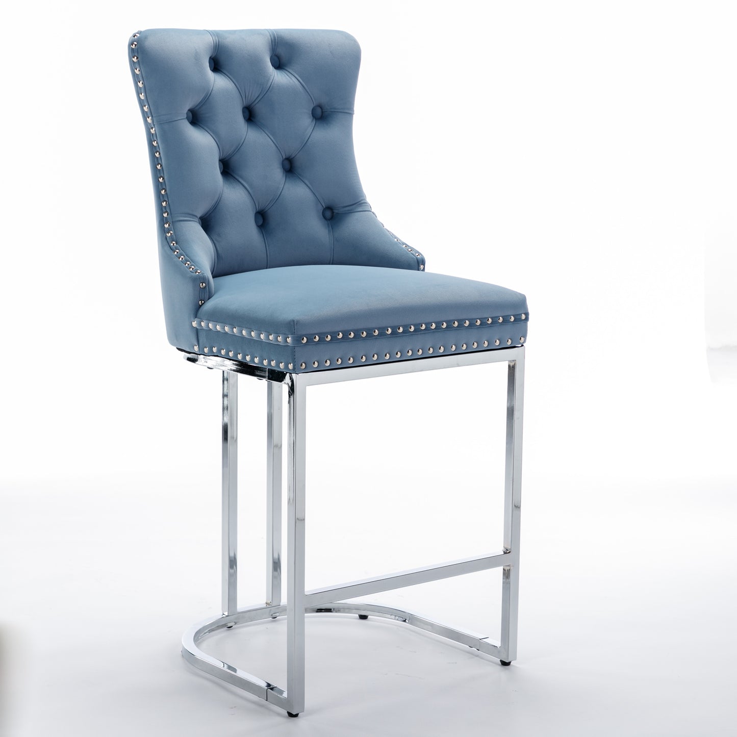Tufted blue velvet bar stool with polished chrome legs and silver nailhead trim