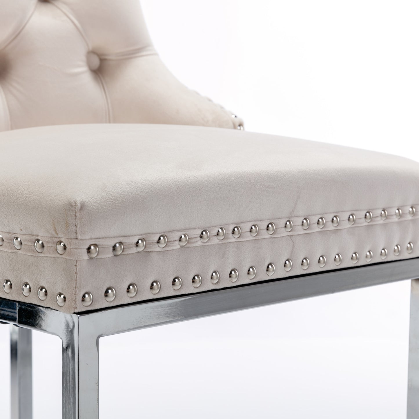 Beige velvet tufted bar stool with silver nailhead trim and chrome legs
