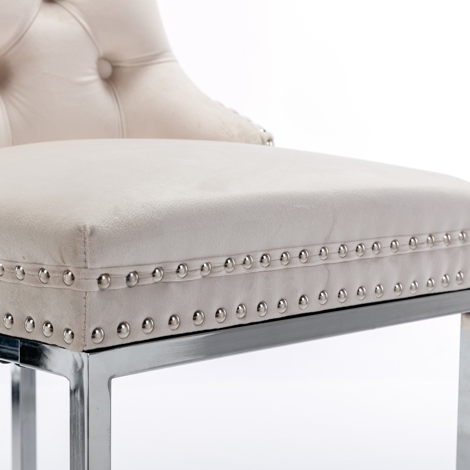 Beige velvet tufted bar stool with silver nailhead trim and chrome legs