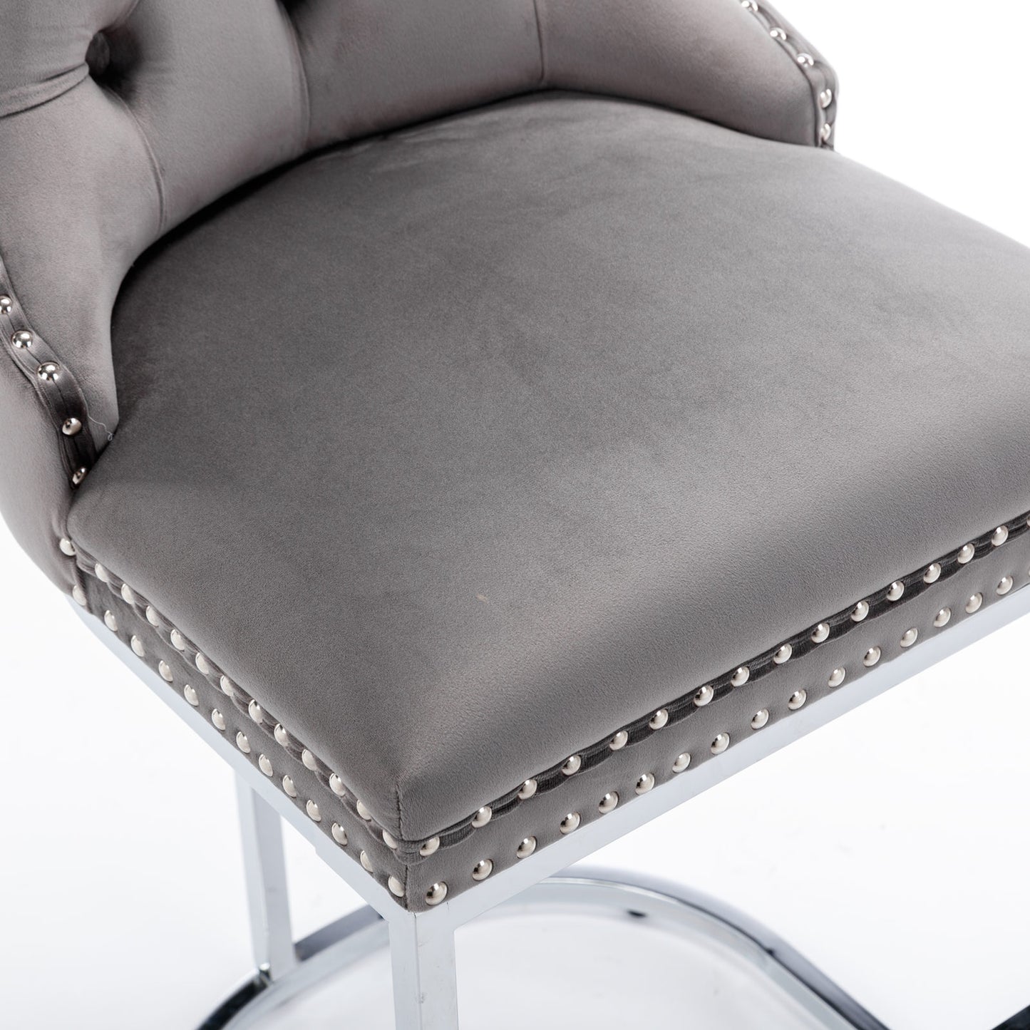 Grey velvet bar stool with silver nailhead trim and tufted back