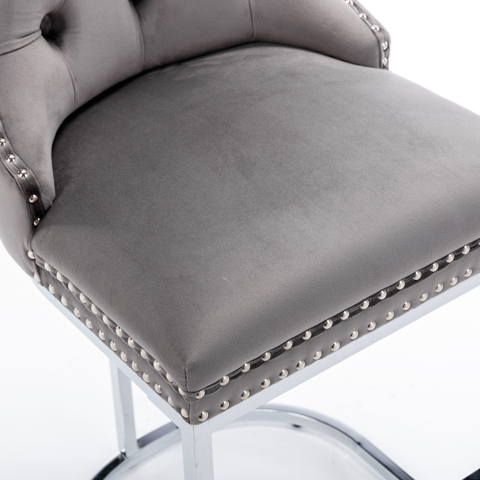 Grey velvet bar stool with silver nailhead trim and tufted back