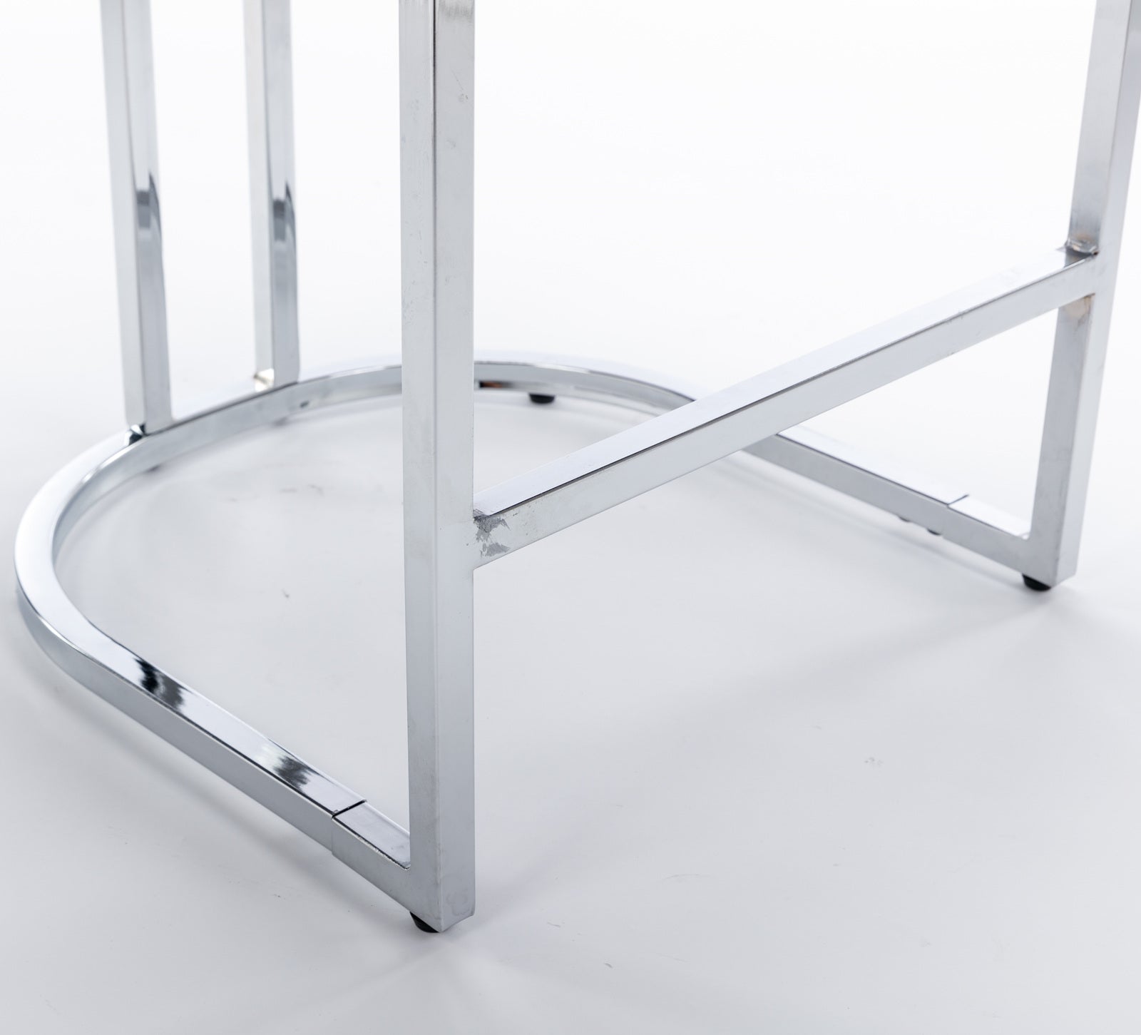 Closeup of chrome bar stool base with Ushaped support