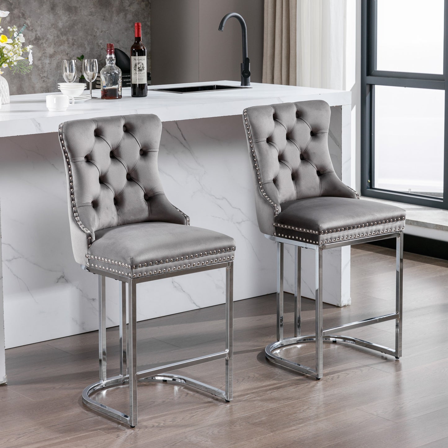 Gray velvet tufted bar stool with silver nailhead trim and chrome legs