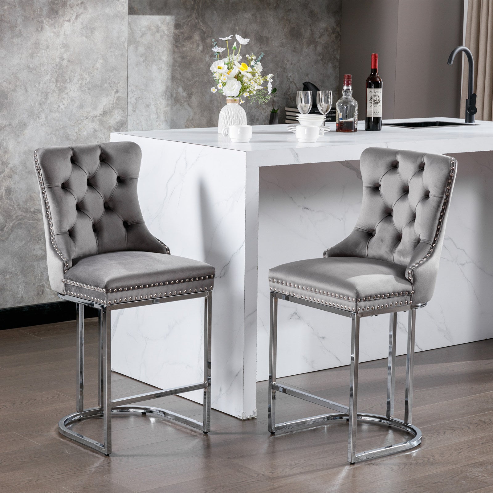 Grey velvet tufted bar stool with silver nailhead trim and chrome legs
