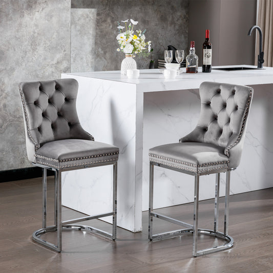 Grey velvet tufted bar stool with silver nailhead trim and chrome legs