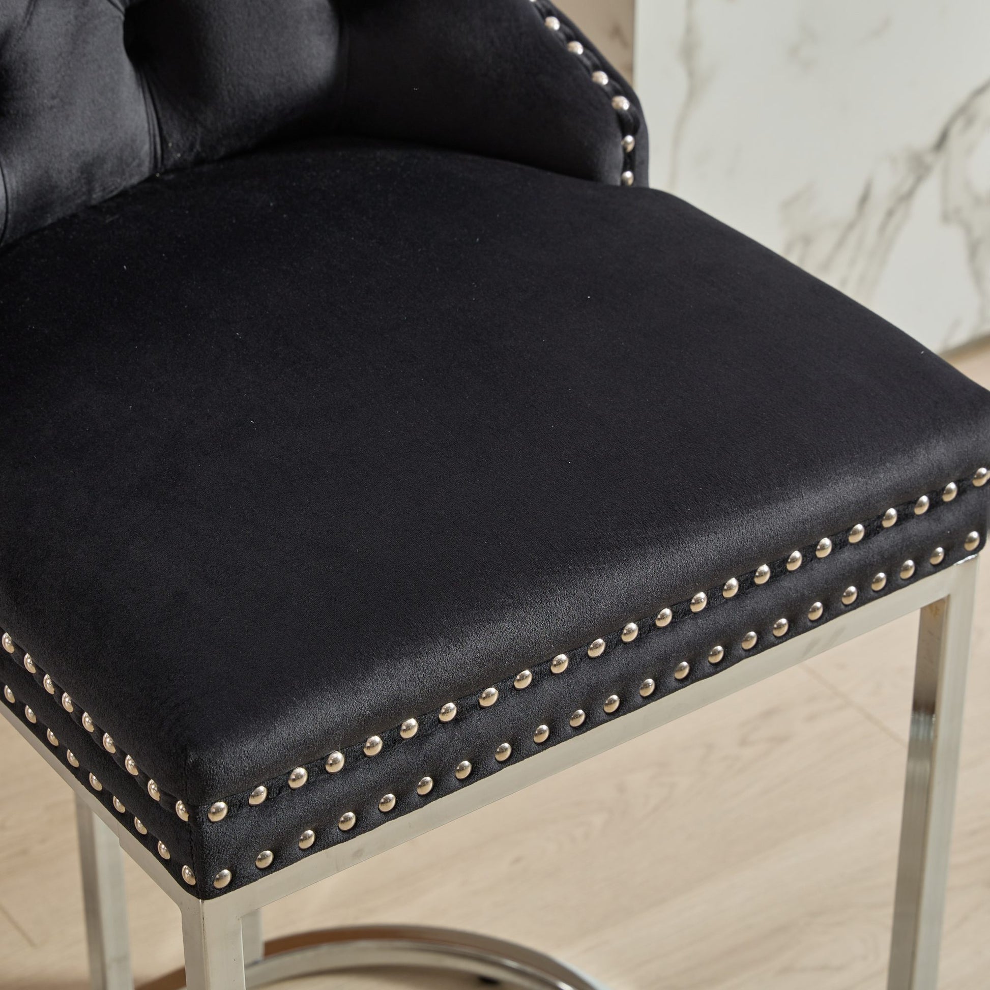Black velvet bar stool with silver nailhead trim