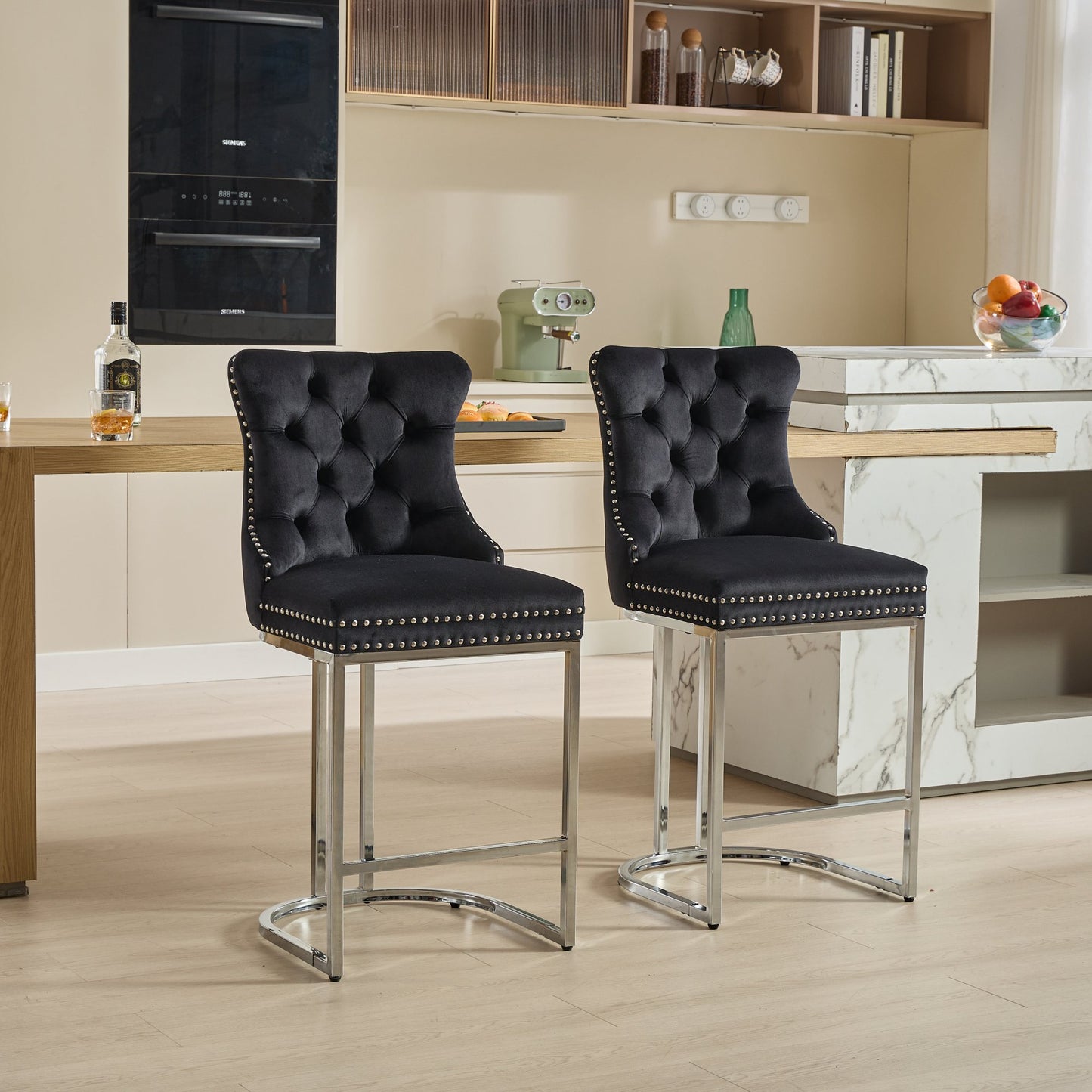 Black velvet tufted bar stool with silver nailhead trim and chrome legs