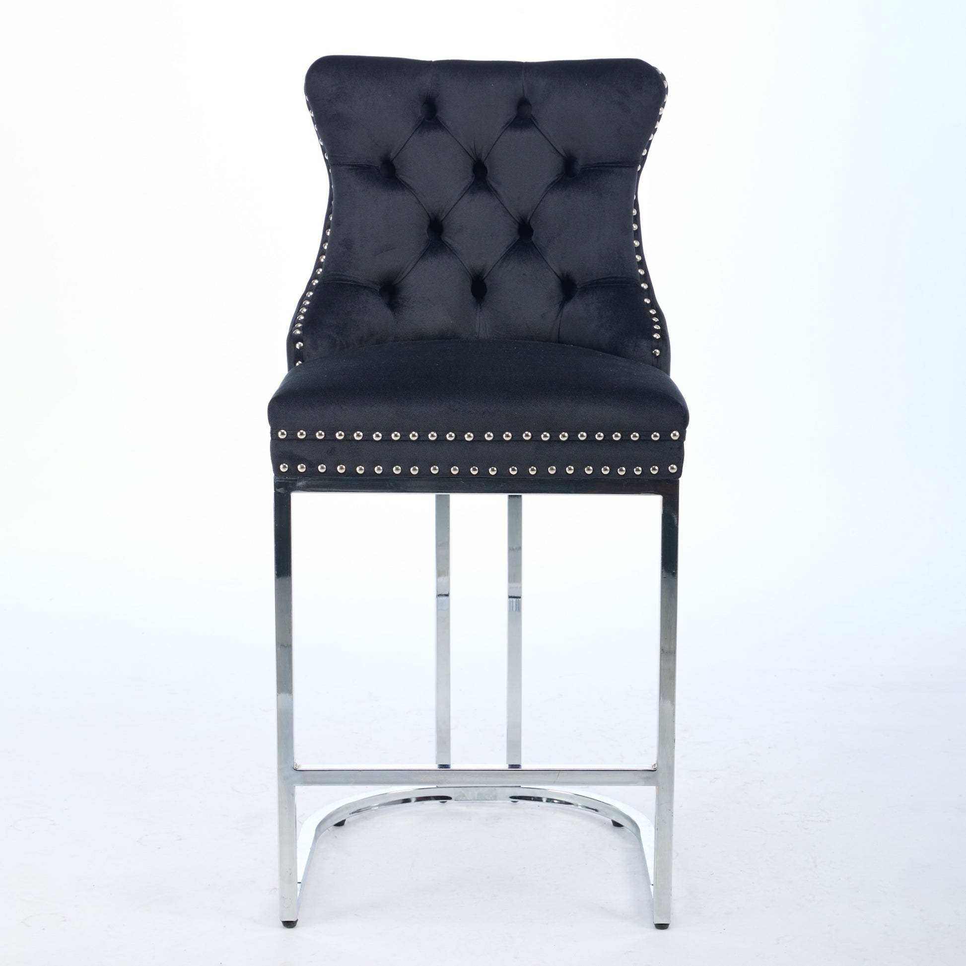 Black velvet bar stool with tufted back and silver nailhead trim