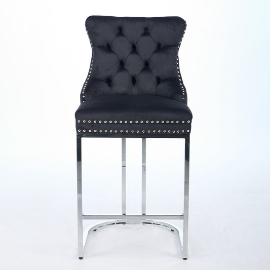 Black velvet bar stool with tufted back and silver nailhead trim