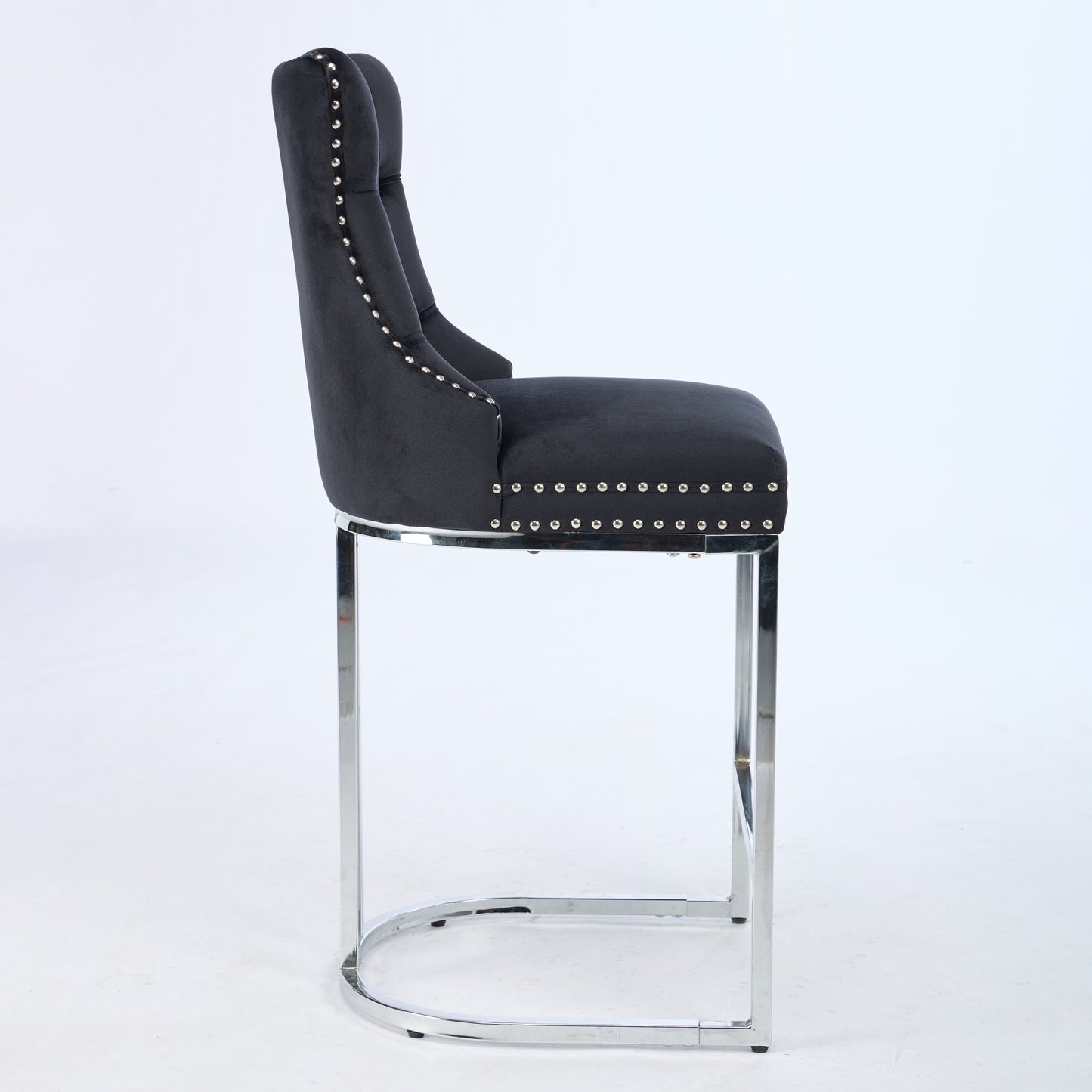 Black velvet bar stool with chrome legs and silver nailhead trim