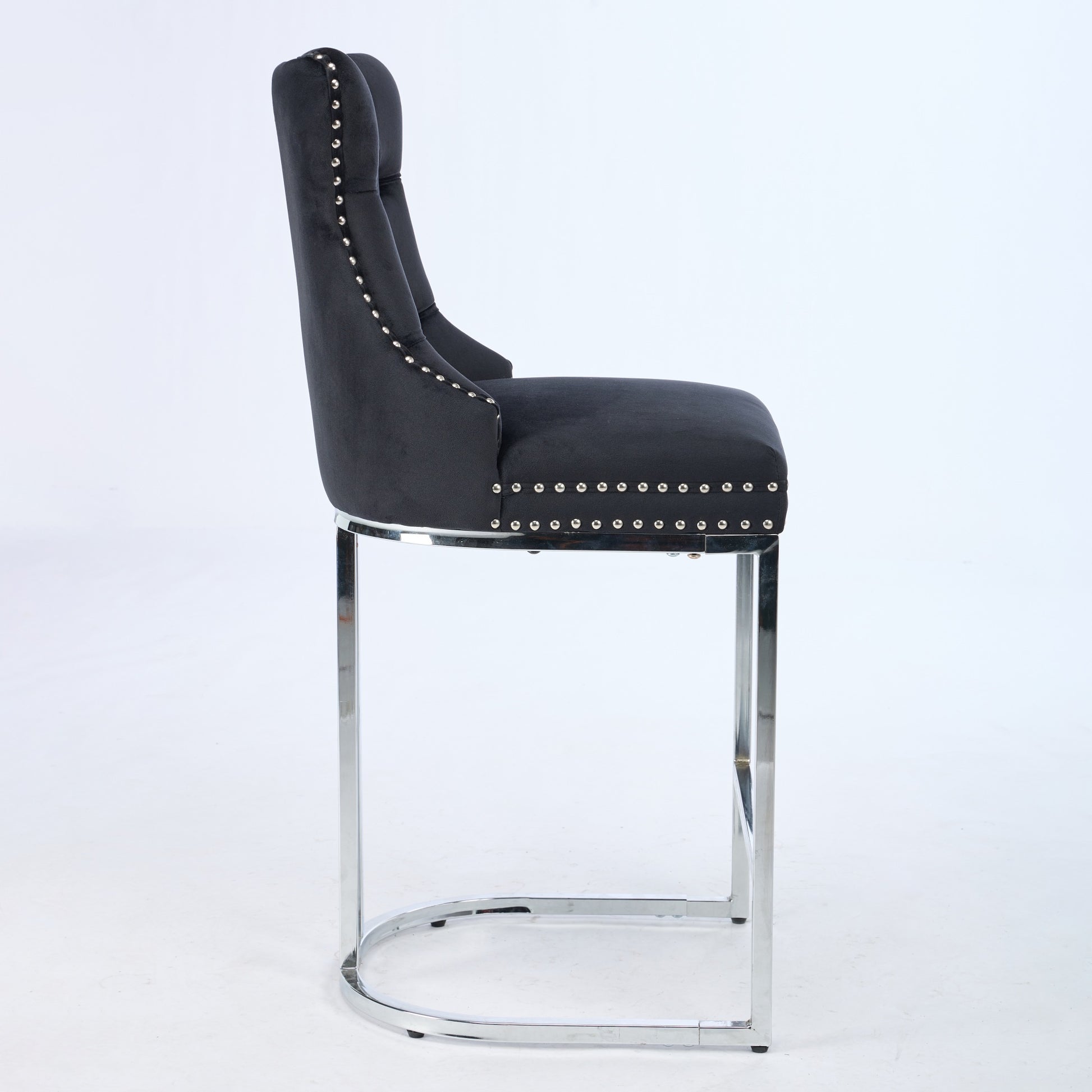 Black velvet bar stool with chrome legs and silver nailhead trim