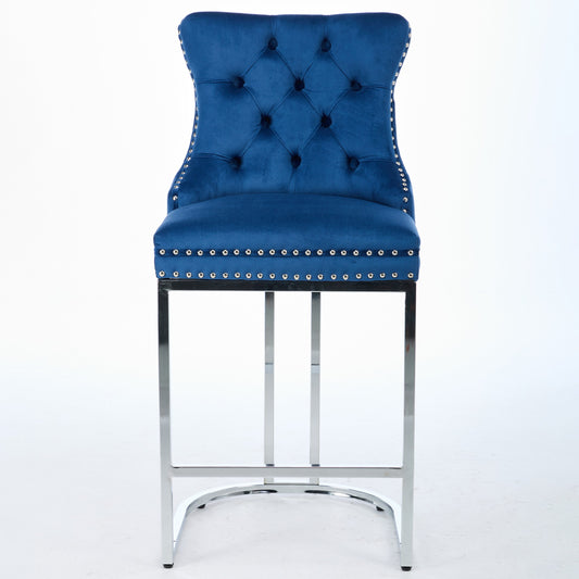 Deep blue velvet tufted bar stool with silver nailhead trim and chrome legs