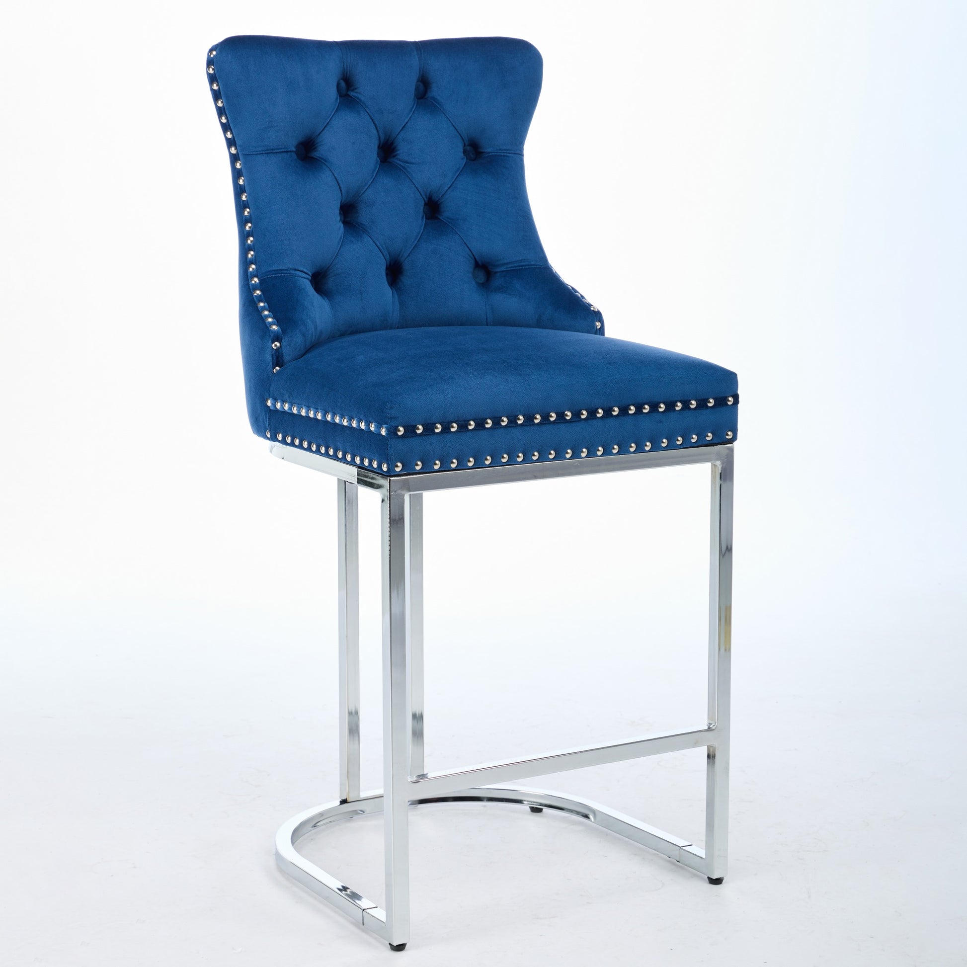 Tufted blue velvet bar stool with silver nailhead trim and chrome legs