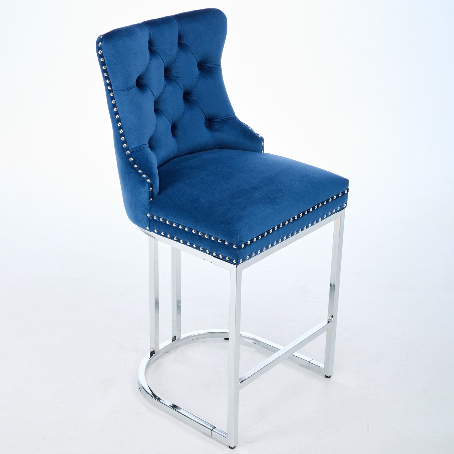 Deep blue velvet tufted bar stool with silver nailhead trim and chrome legs
