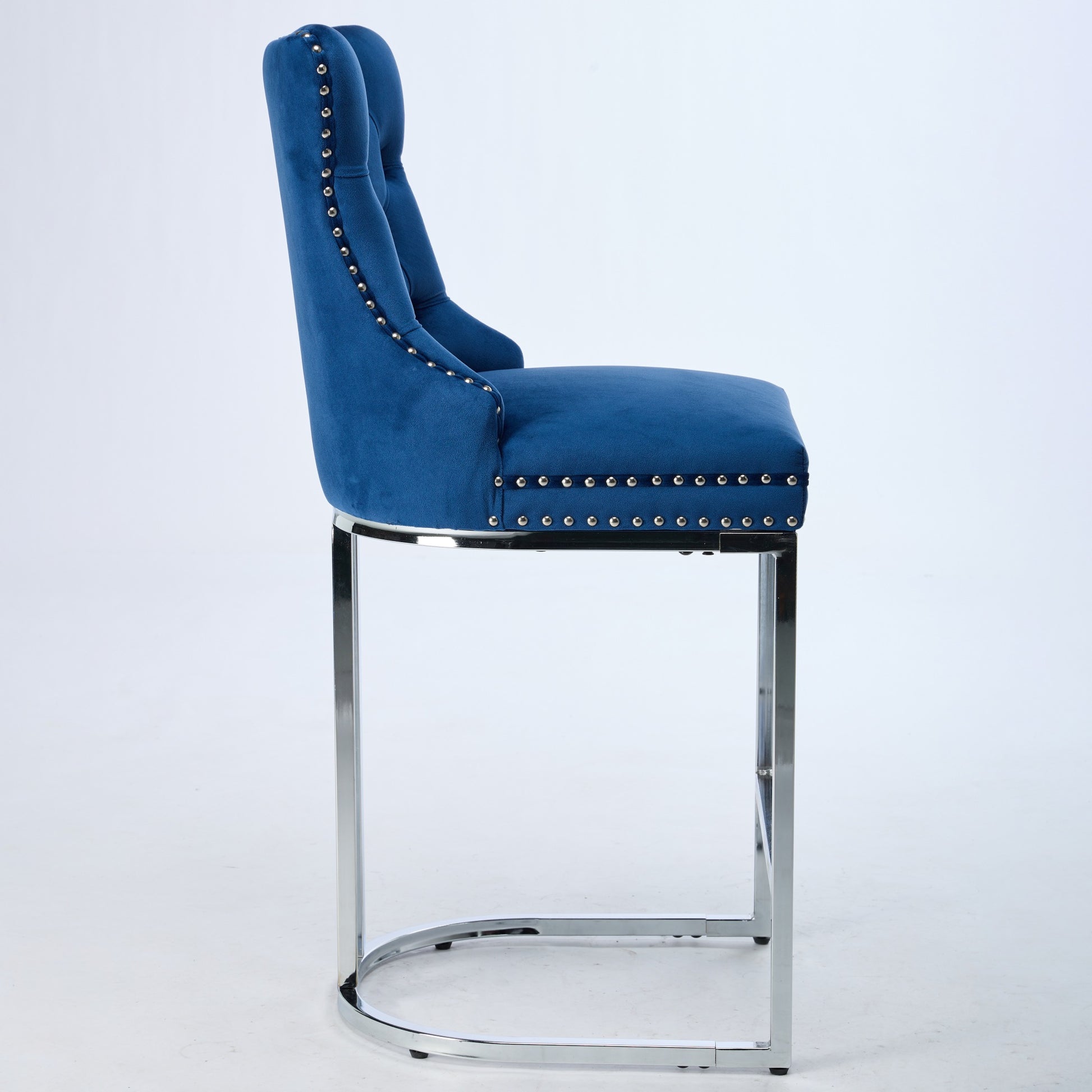 Deep blue velvet tufted bar stool with polished chrome legs