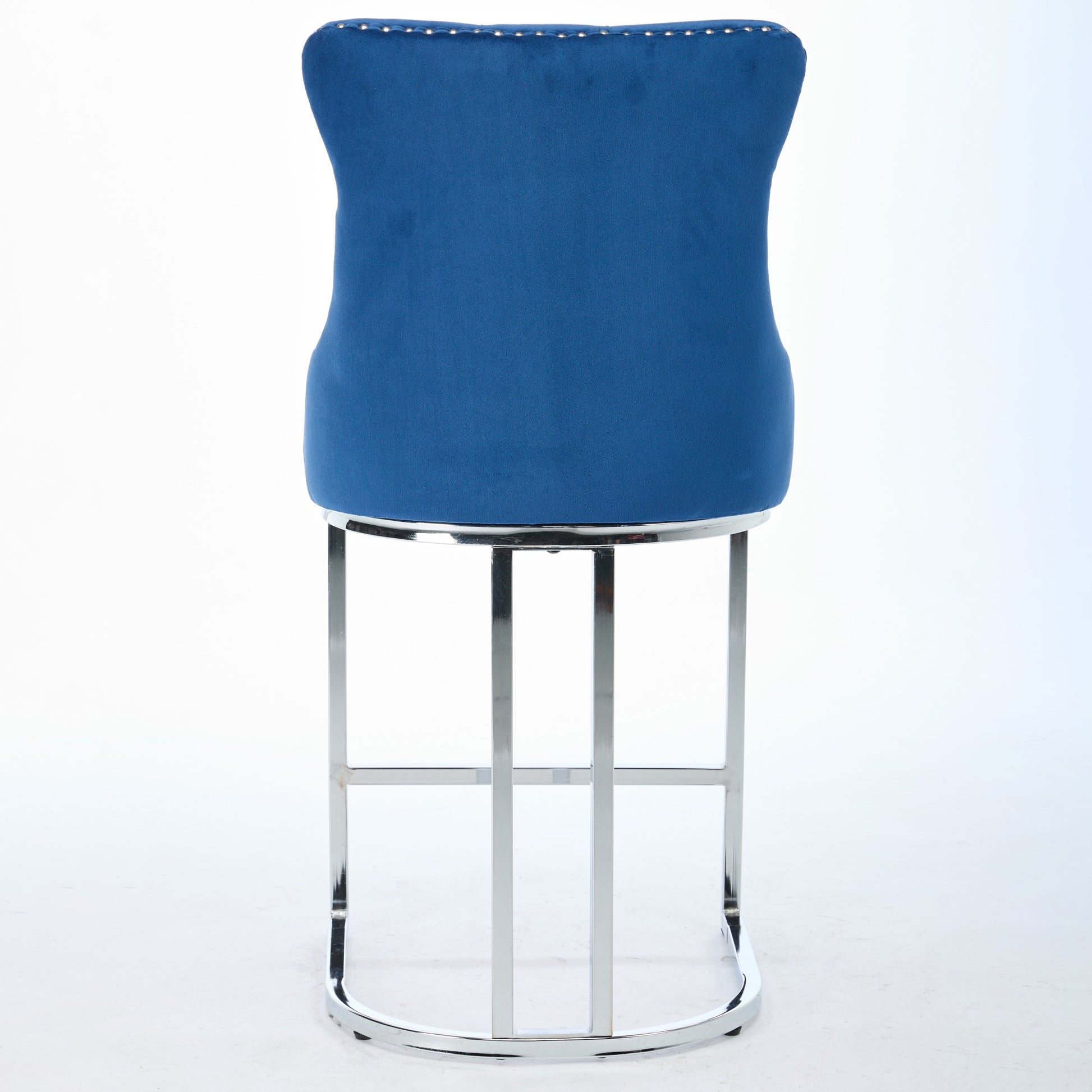 Deep blue velvet bar stool with polished chrome base and nailhead trim