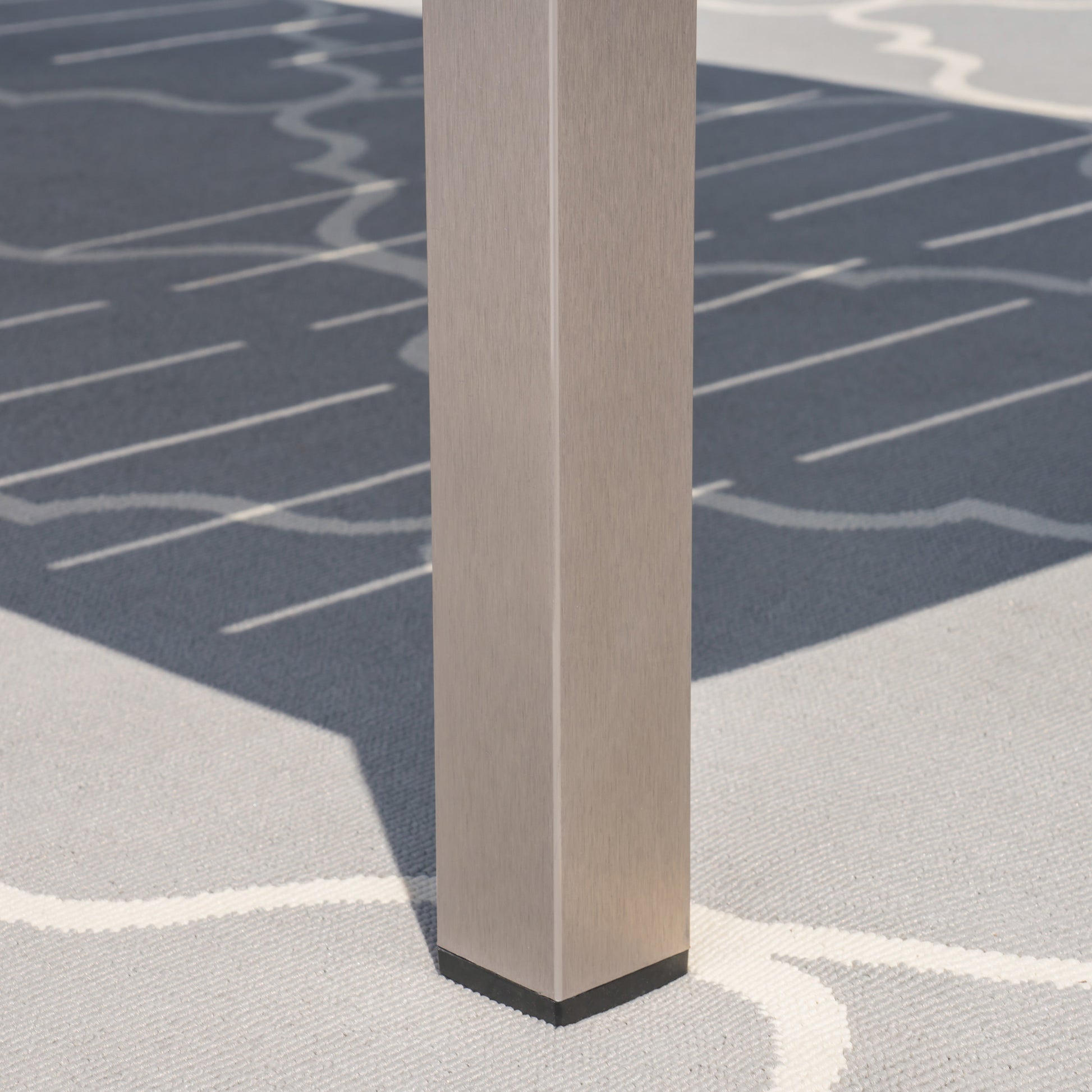 Brushed nickel metal table leg with black base