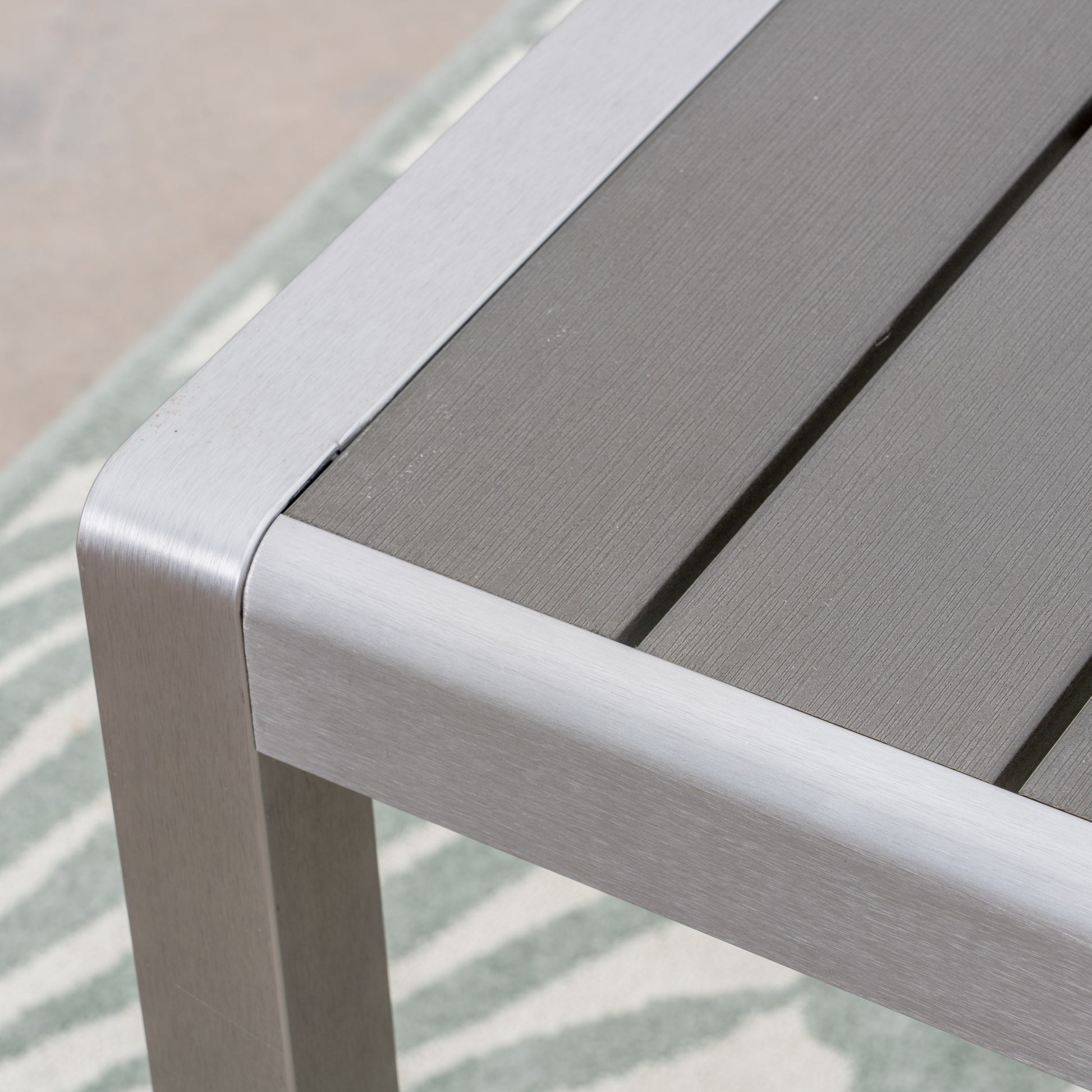 Gray aluminum outdoor coffee table with slatted top