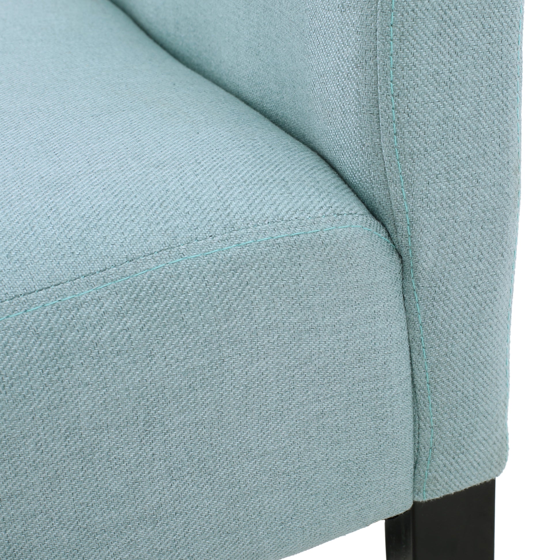 Closeup of textured blue fabric on a chair