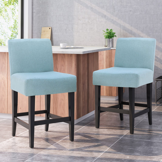 Light blue upholstered bar stool with black wooden legs