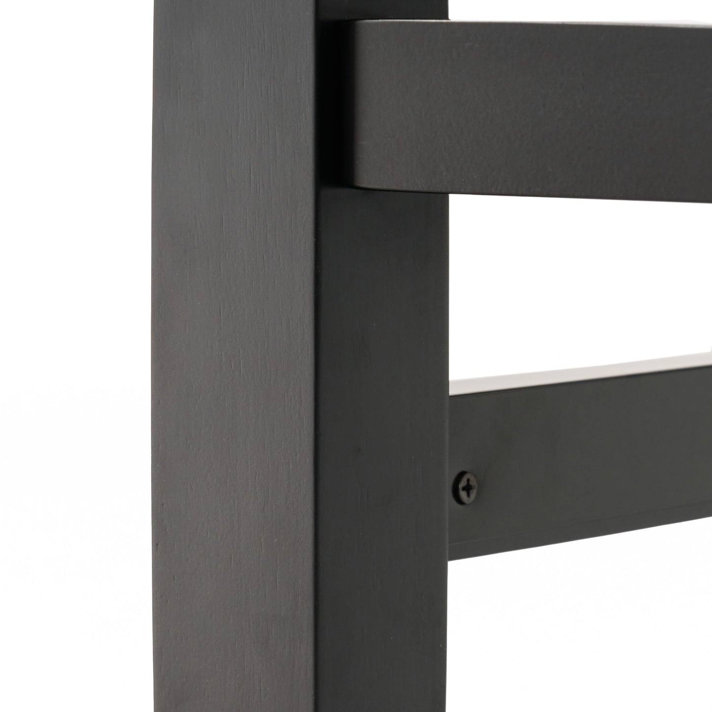 Black wooden chair leg detail with visible wood grain texture
