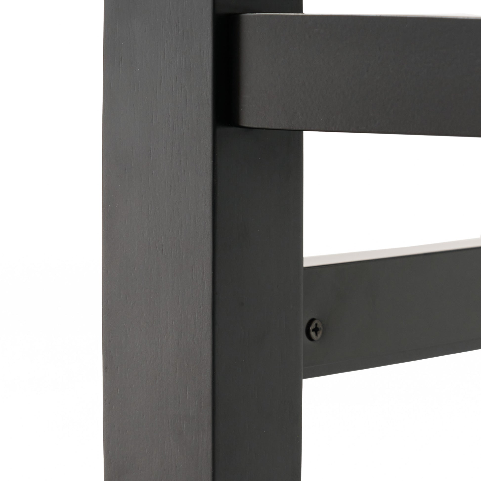 Black wooden chair leg detail with visible wood grain texture