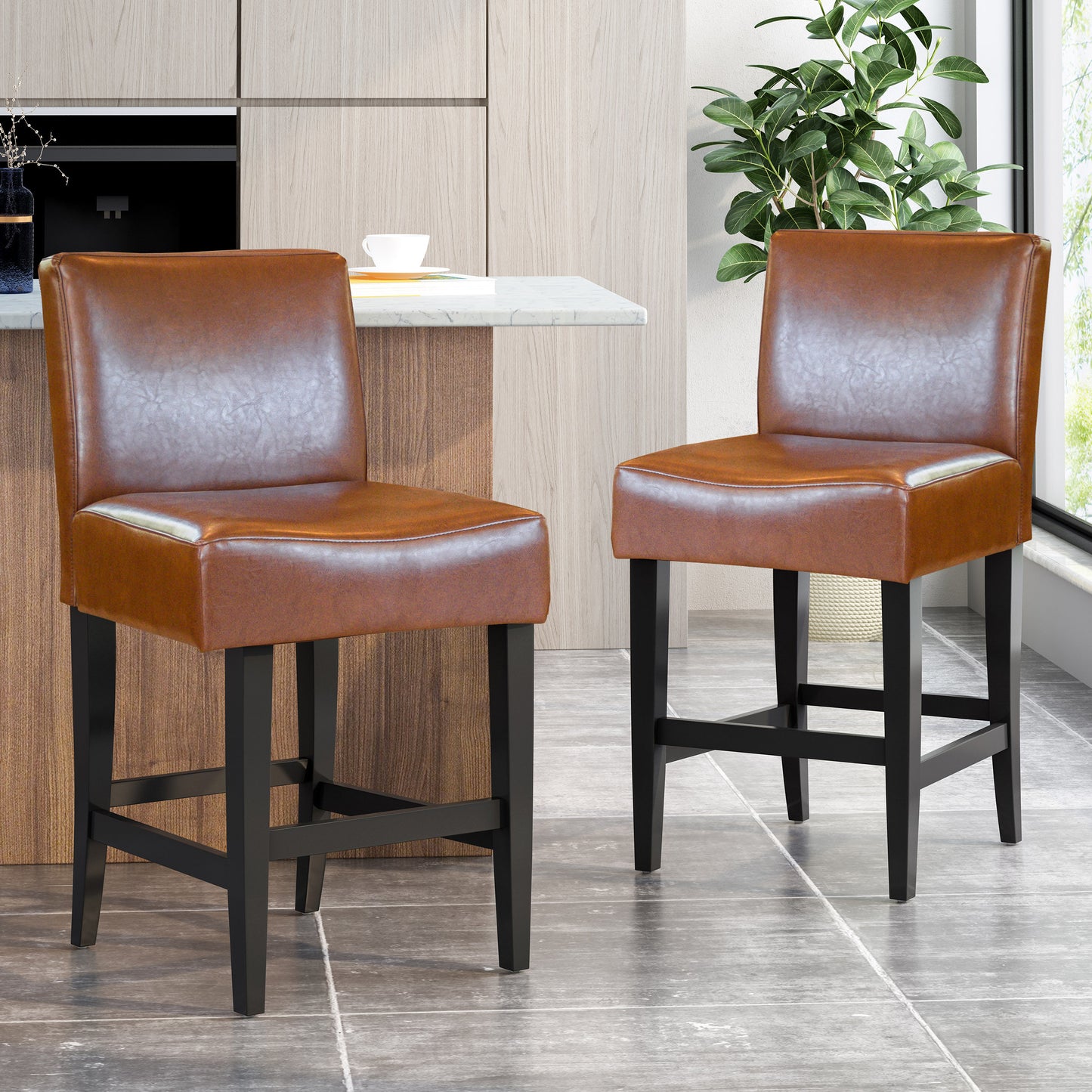 Pair of brown leatherette bar stools with black wood legs