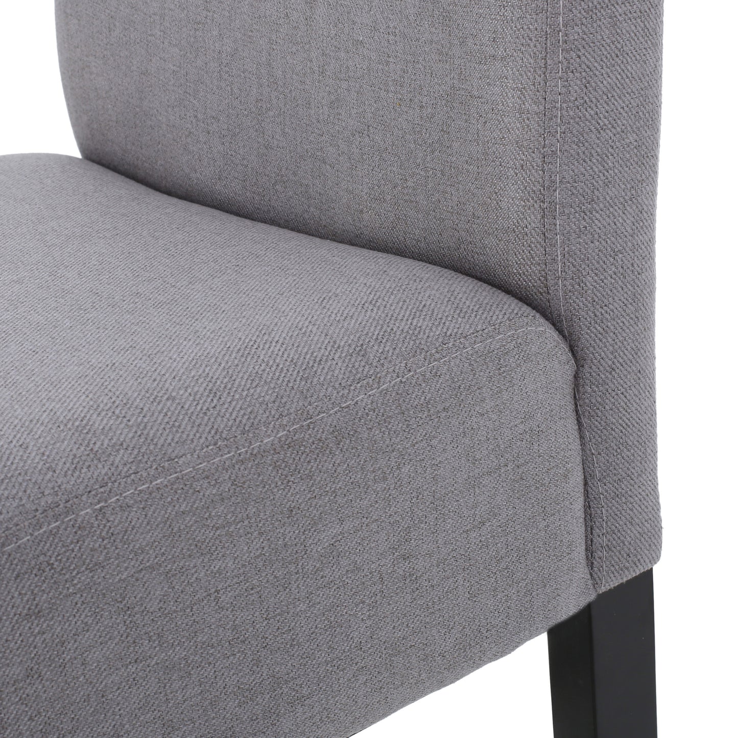 Closeup of grey textured fabric on a modern dining chair