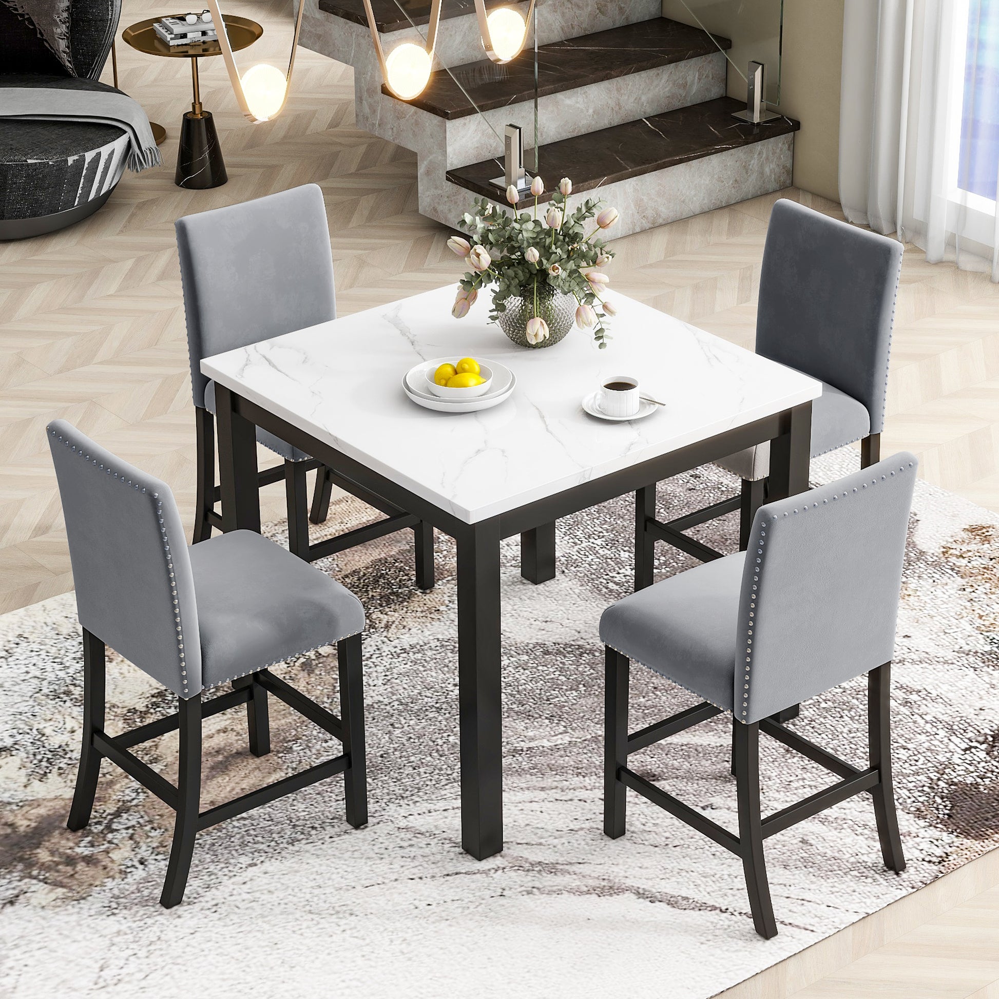 Gray velvet bar stool with nailhead trim and black legs