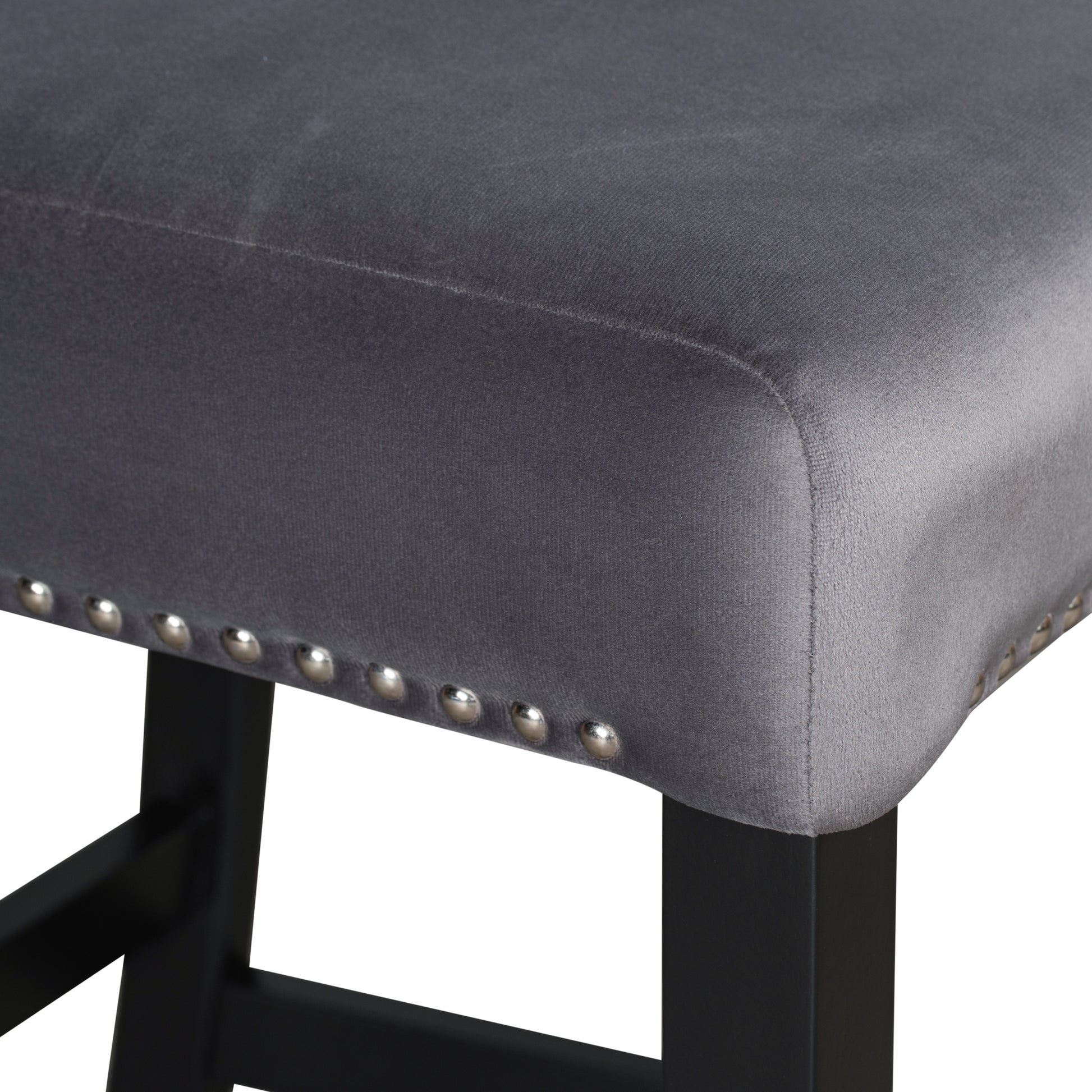 Grey velvet bar stool seat with silver nailhead trim and black legs