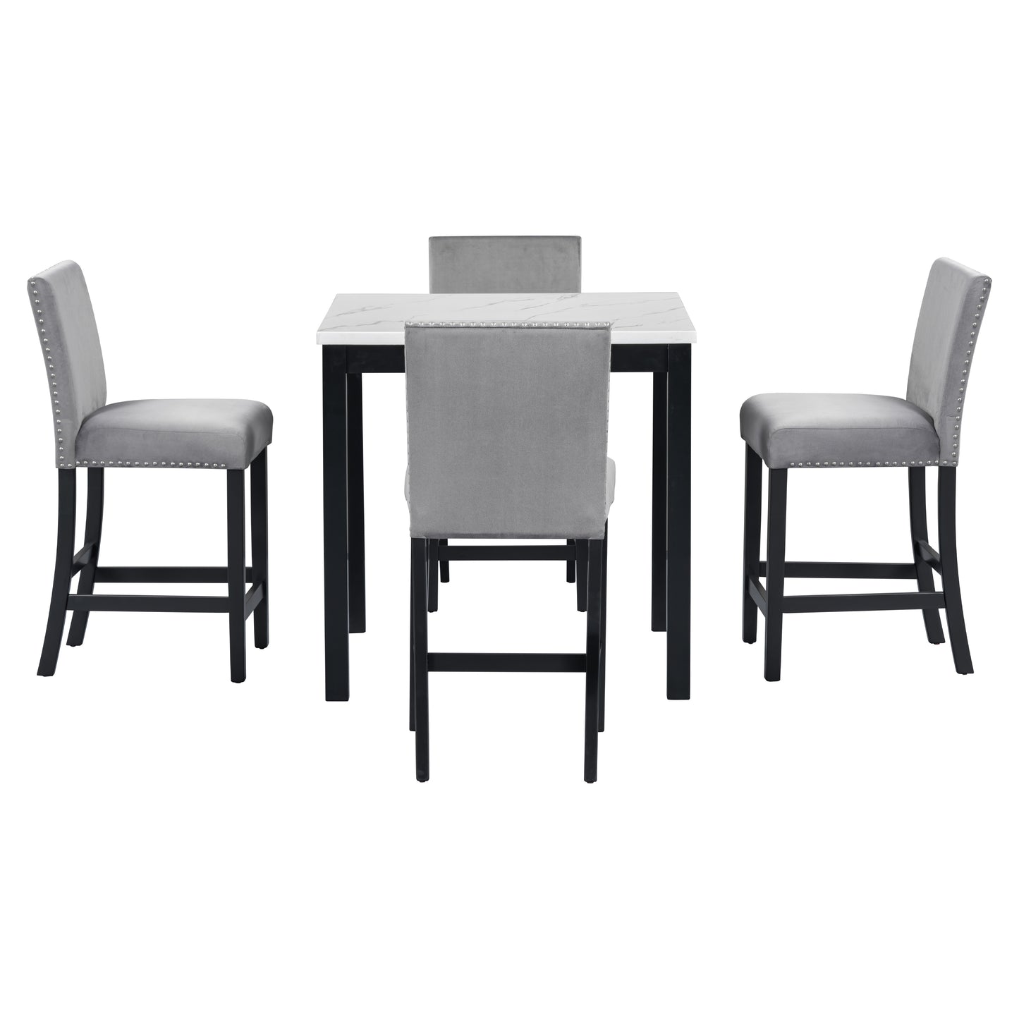 Grey velvet bar stools with silver nailhead trim surround a marbletop bar height table
