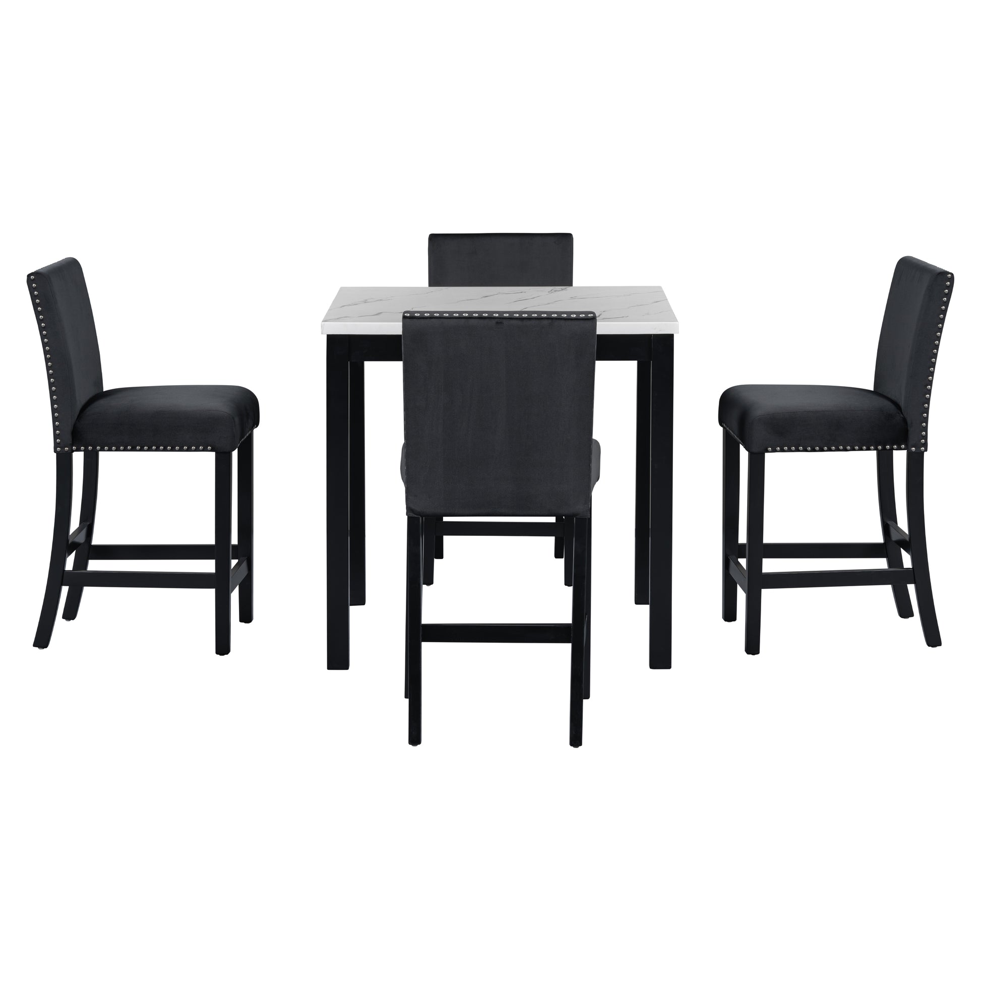 Black velvet bar stools with silver nailhead trim surround a white marbletop bar table